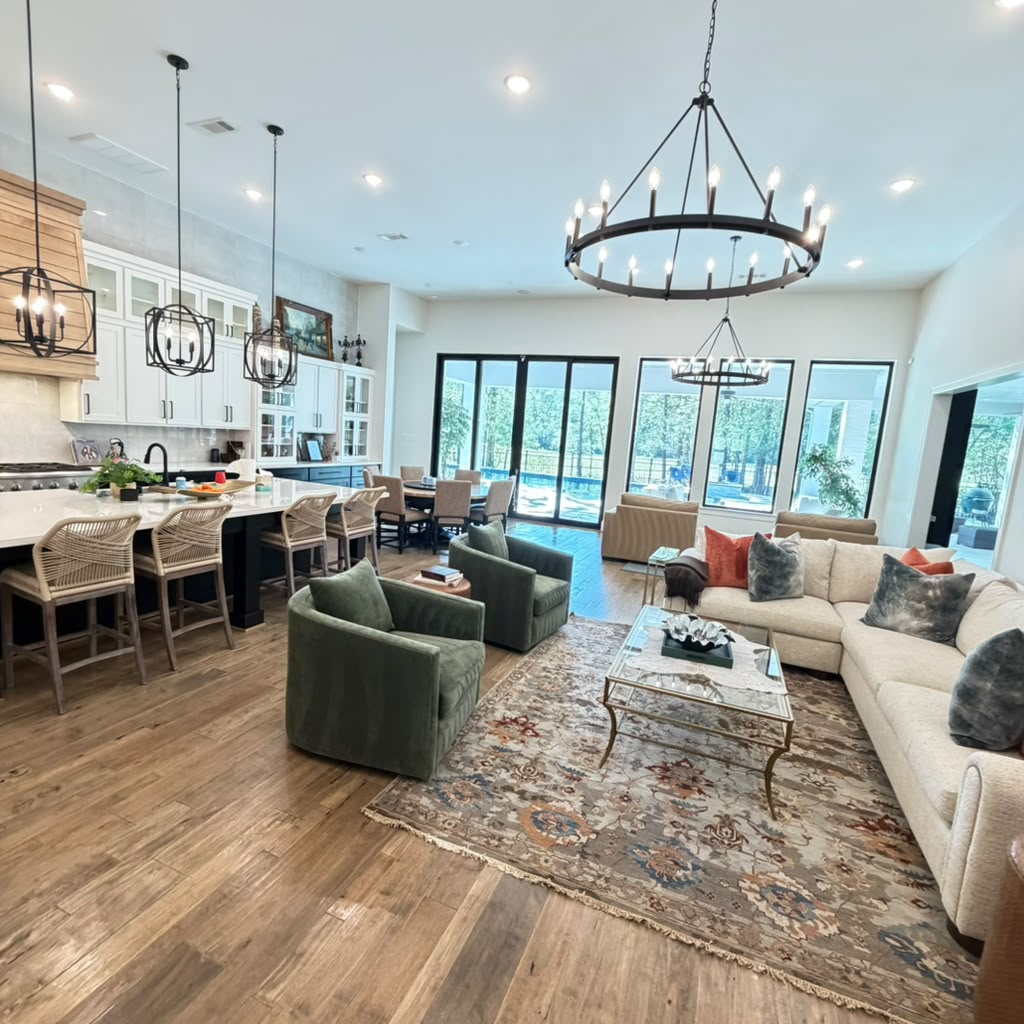 Beautifully organized and spotlessly clean living room with sunlight streaming through windows onto polished floors