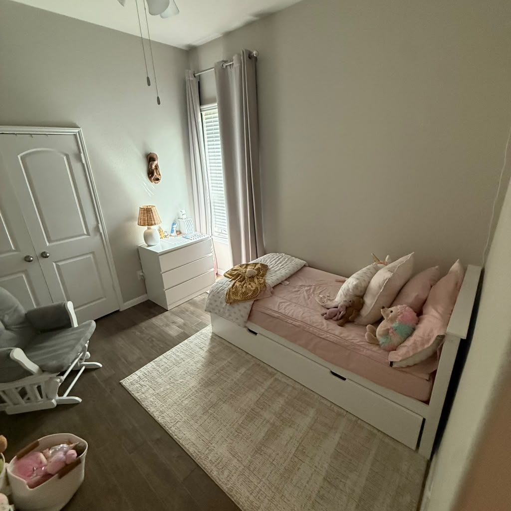 Professional Iron Maids cleaning team working together in a bright, modern home interior