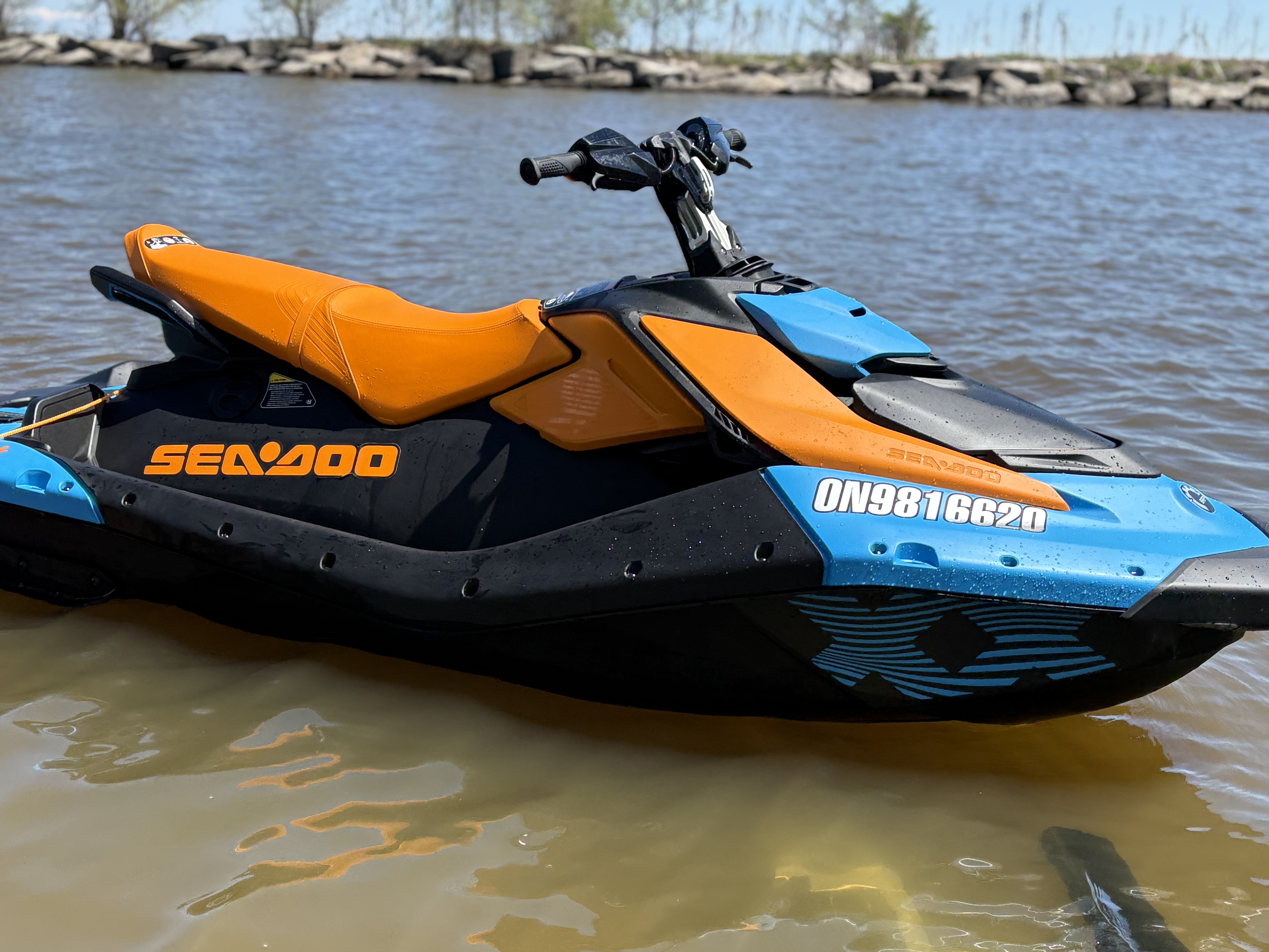 Person riding a Sea-Doo Spark Trixx jetski on the water