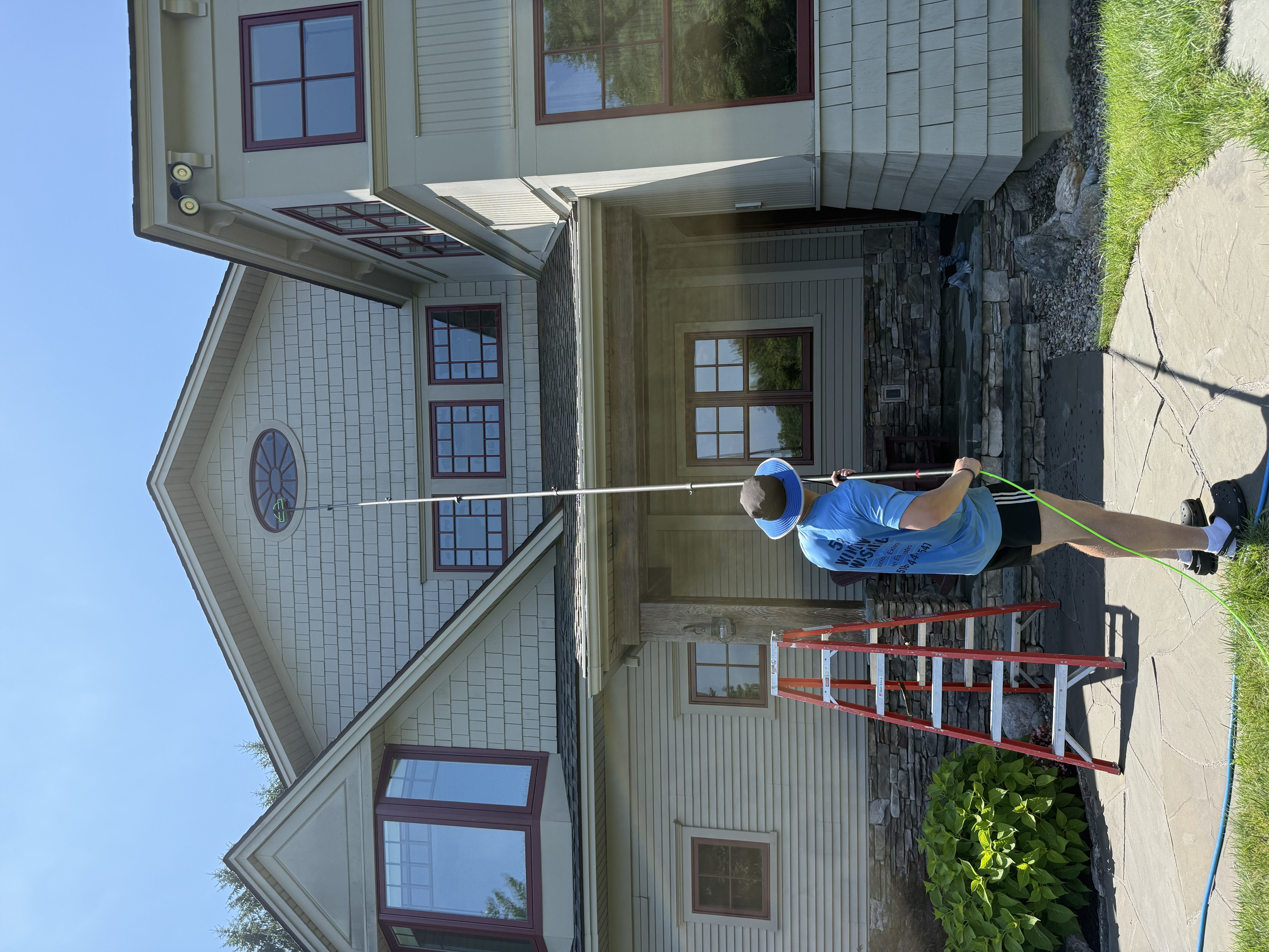 Pristine home exterior with sparkling clean windows washed by 518 Window Washing in the Capital Region