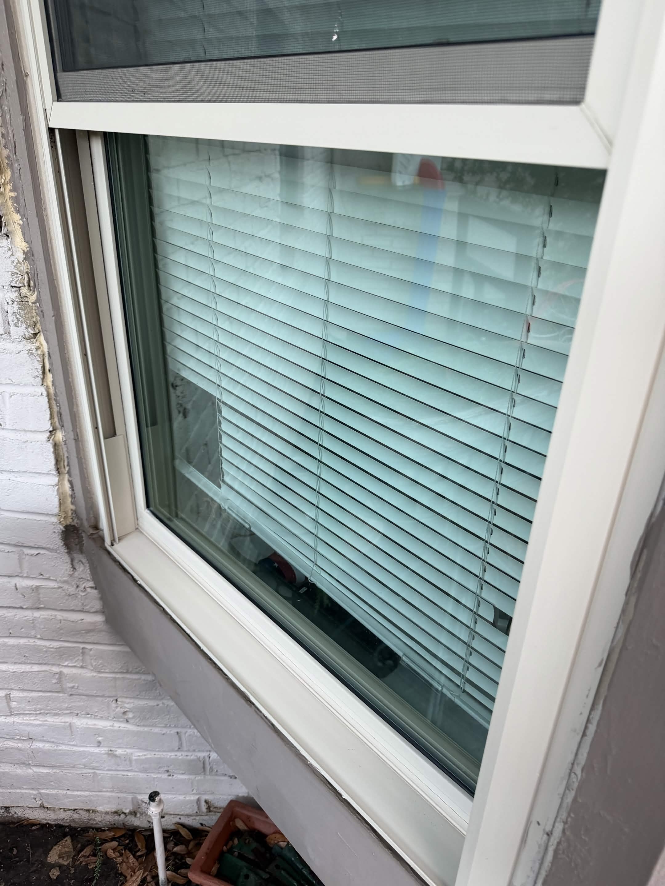 Crystal clear spotless window after professional cleaning by 518 Window Washing