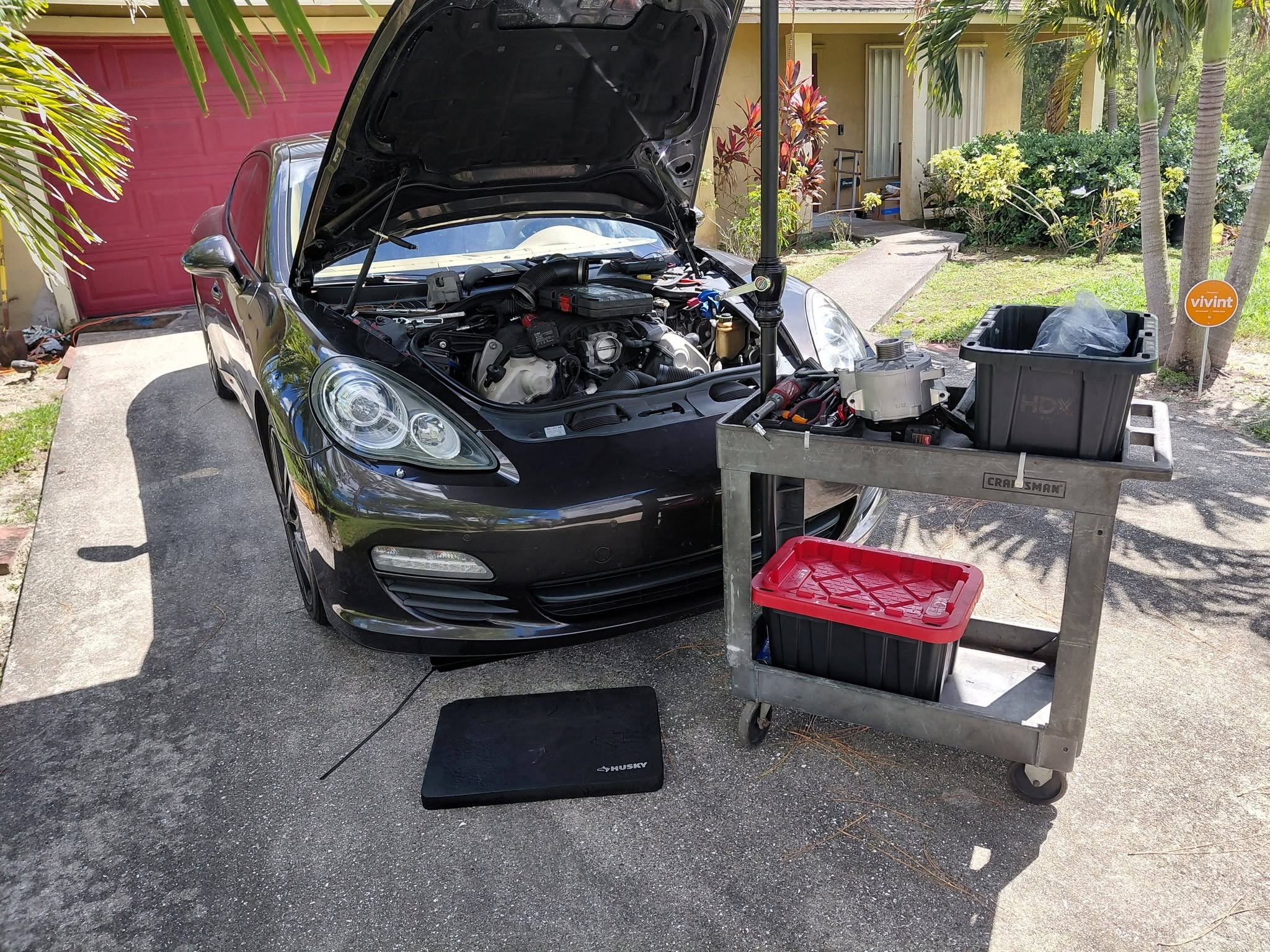 Professional mobile mechanic repairing a vehicle engine on location