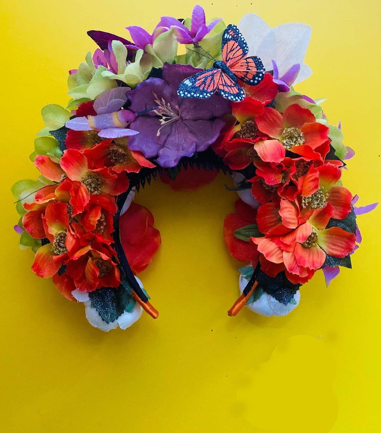 Elaborate custom folklorico hairpiece with red and green ribbons and gold details