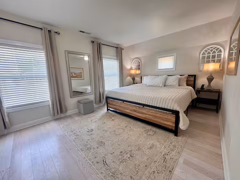 PLACEHOLDER - Replace with your actual photo: Master bedroom retreat at The W at Wildemere Beach with king-sized bed and ocean view window