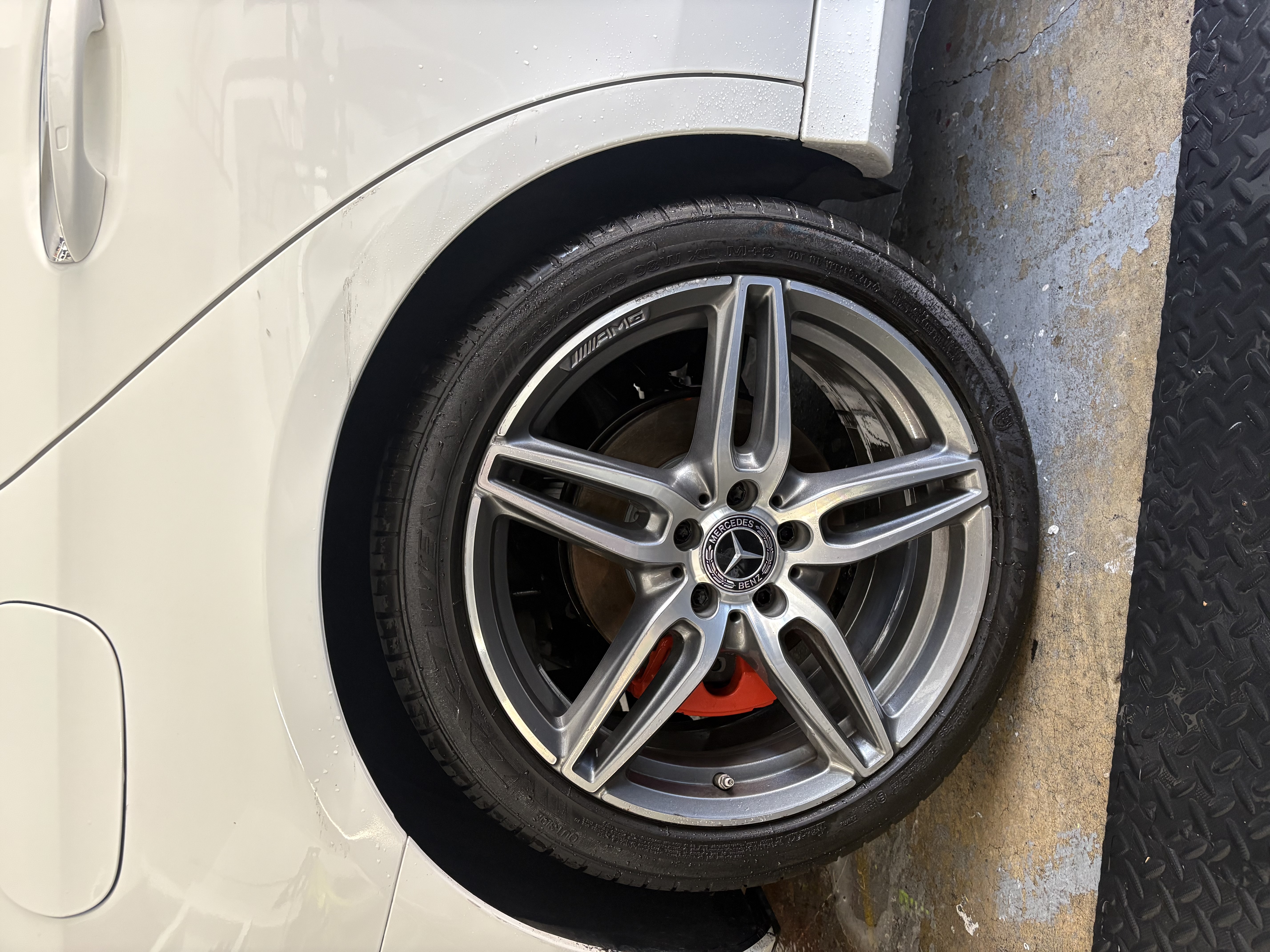 Close-up of a perfectly clean and shining multi-spoke alloy wheel on a sports car