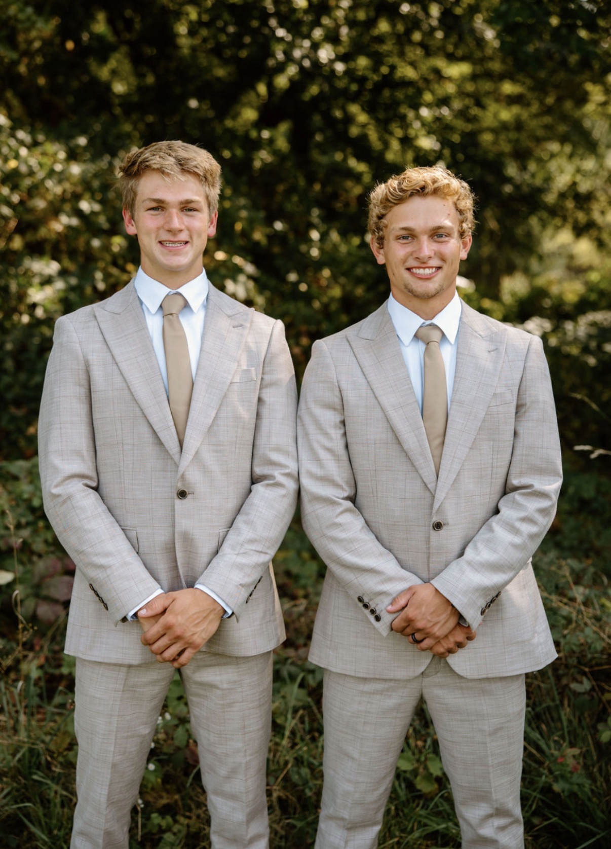 Portrait of the Scholten family owners standing together in professional attire outside their exterior cleaning business