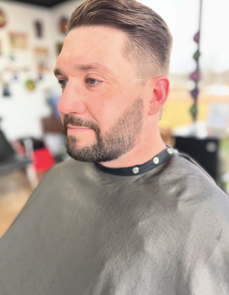 Claude's Barbershop signature haircut showcasing precision fade and classic styling by master barber