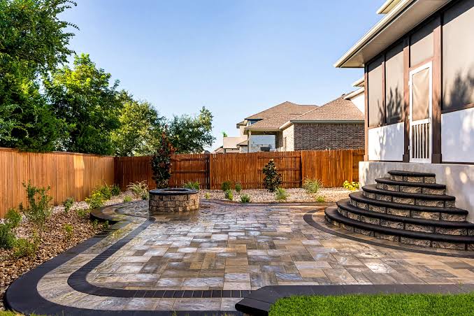 Vibrant 3D landscape design rendering showing a complete backyard with pool, garden beds, and mature trees