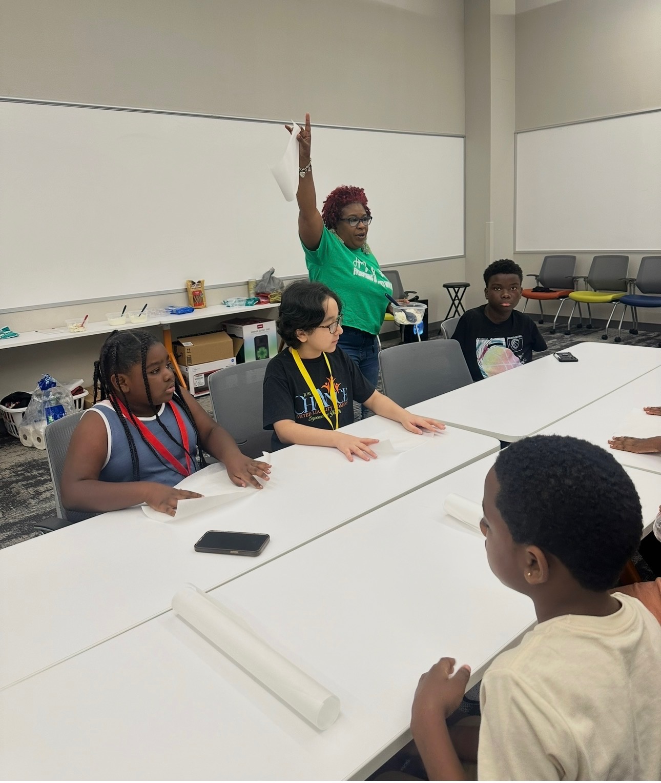Dedicated mentor providing academic support to a focused teenager